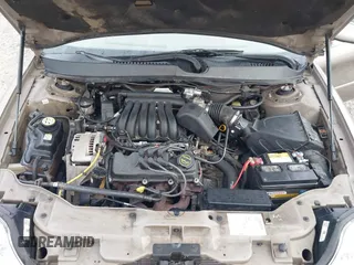 2003 Mercury Sable GS z VIN 1MEFM50U33A606937, wystawiony jako IAAI lot #41058899 z przebiegiem 138 479 mil mil oraz . Historia ofert i sprzedaży dostępna na DreamBid. Obrazek 10.