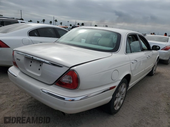 2004 Jaguar XJ with VIN SAJWA71C44SG34094, listed as a Copart auction lot 74969004 with 0 mi miles and Salvage Title. Bid and sale history available at carsss.com. Image 3.