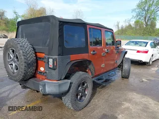 2010 Jeep Wrangler Unlimited Sport with VIN 1J4HA3H1XAL189667, listed as a IAAI auction lot 42062351 with 144,838 mi miles. Bid and sale history available at carsss.com. Image 4.