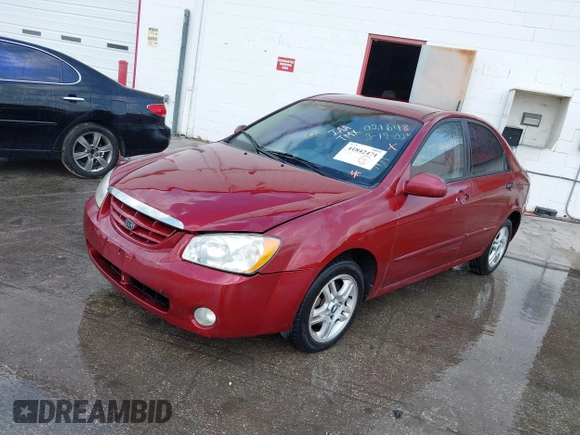 2004 Kia Spectra LX with VIN KNAFE121545021648, listed as a IAAI auction lot 41842471 with 211,436 mi miles. Bid and sale history available at carsss.com. Image 2.