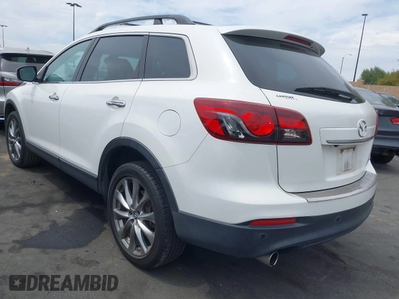 2015 Mazda CX-9 Grand Touring z VIN JM3TB2DV9F0458340, wystawiony jako IAAI lot #42021843 z przebiegiem 145 929 mil mil oraz . Historia ofert i sprzedaży dostępna na DreamBid. Obrazek 3.