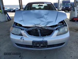 2002 Mazda Protege DX with VIN JM1BJ225120605237, listed as a Copart auction lot 49331225 with 184,556 mi miles and Salvage Title. Bid and sale history available at DreamBid. Image 5.