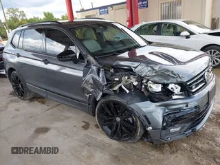 2021 Volkswagen Tiguan SE z VIN 3VV3B7AX4MM119671, wystawiony jako IAAI lot #42577943 z przebiegiem 69 804 mil mil oraz . Historia ofert i sprzedaży dostępna na DreamBid. Obrazek 1.