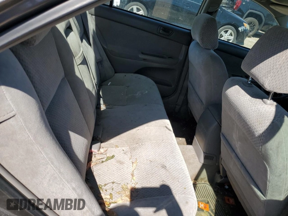2003 Toyota Camry LE z VIN 4T1BF32K93U566965, wystawiony jako Copart lot #71979144 z przebiegiem 267 228 mil mil oraz Szkoda całkowita • Salvage title. Historia ofert i sprzedaży dostępna na DreamBid. Obrazek 10.
