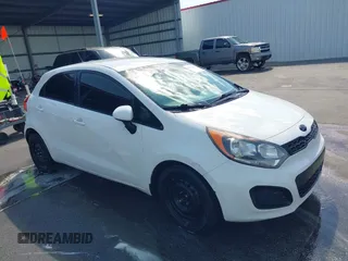 2013 Kia Rio LX with VIN KNADM5A3XD6167042, listed as a IAAI auction lot 41870156 with 215,767 mi miles. Bid and sale history available at carsss.com. Image 1.