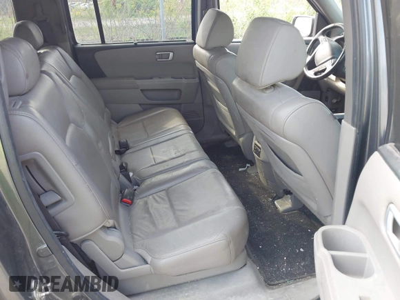 2011 Honda Pilot Touring with VIN 5FNYF4H90BB103824, listed as a IAAI auction lot 42127137 with 243,858 mi miles and . Bid and sale history available at carsss.com. Image 8.