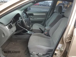 2007 Suzuki Forenza z VIN KL5JD56Z07K657218, wystawiony jako Copart lot #86767854 z przebiegiem 93 044 mil mil oraz Szkoda całkowita • Salvage title. Historia ofert i sprzedaży dostępna na DreamBid. Obrazek 7.