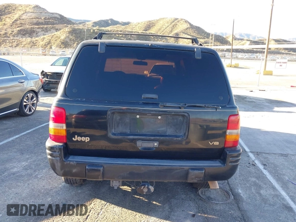 1998 Jeep Grand Cherokee Limited with VIN 1J4GX78Y8WC110325, listed as a IAAI auction lot 41357373 with 165,106 mi miles. Bid and sale history available at carsss.com. Image 16.