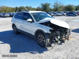 2021 Volkswagen Tiguan S with VIN 3VV1B7AX9MM056025, listed as a IAAI auction lot 41352521 with 98,944 mi miles. Bid and sale history available at carsss.com. Image 1.