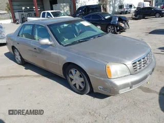 2004 Cadillac DeVille DTS z VIN 1G6KF57974U142551, wystawiony jako IAAI lot #41919748 z przebiegiem 93 025 mil mil oraz . Historia ofert i sprzedaży dostępna na DreamBid. Obrazek 1.