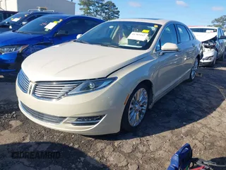 2016 Lincoln MKZ z VIN 3LN6L2G9XGR605070, wystawiony jako IAAI lot #41705442 z przebiegiem 136 565 mil mil oraz . Historia ofert i sprzedaży dostępna na DreamBid. Obrazek 2.