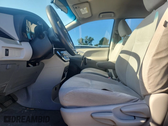 2015 Toyota Sienna L with VIN 5TDZK3DC6FS609767, listed as a Copart auction lot 61188585 with 136,286 mi miles and Salvage title. Bid and sale history available at DreamBid. Image 7.
