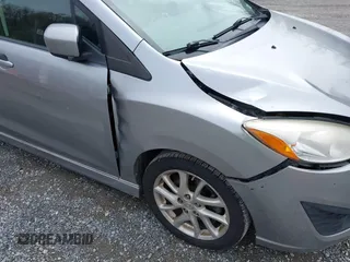 2012 Mazda 5 Touring with VIN JM1CW2CLXC0100740, listed as a IAAI auction lot 41918794 with 234,102 mi miles and . Bid and sale history available at DreamBid. Image 13.
