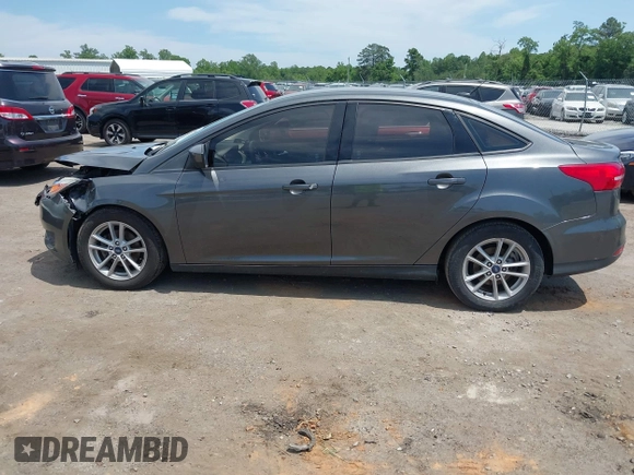 2018 Ford Focus SE with VIN 1FADP3FE2JL227679, listed as a IAAI auction lot 42296608 with 128,269 mi miles and . Bid and sale history available at DreamBid. Image 14.