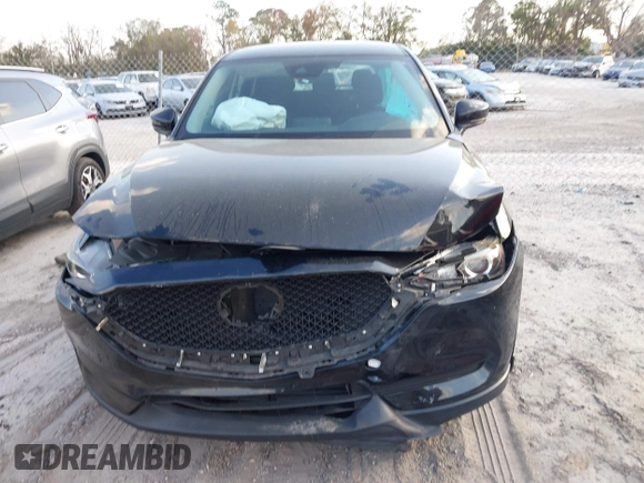 2019 Mazda CX-5 Sport with VIN JM3KFABMXK0693540, listed as a IAAI auction lot 41523569 with 57,895 mi miles and . Bid and sale history available at DreamBid. Image 12.