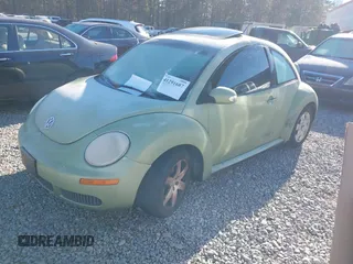 2007 Volkswagen New Beetle Coupe with VIN 3VWRW31C57M519484, listed as a IAAI auction lot 41291687 with 203,516 mi miles. Bid and sale history available at carsss.com. Image 2.