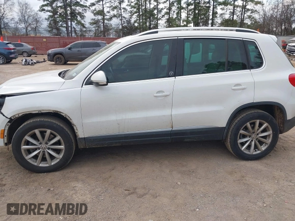 2017 Volkswagen Tiguan Wolfsburg Edition with VIN WVGRV7AX5HK019734, listed as a IAAI auction lot 41391911 with 123,005 mi miles and . Bid and sale history available at DreamBid. Image 14.