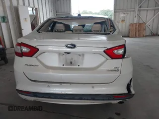 2013 Ford Fusion SE Hybrid with VIN 3FA6P0LU8DR357054, listed as a IAAI auction lot 42372168 with 143,979 mi miles and . Bid and sale history available at DreamBid. Image 16.