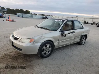 2001 Mazda Protege LX with VIN JM1BJ225310467814, listed as a Copart auction lot 77675414 with Not Provided miles and Salvage Title. Bid and sale history available at carsss.com. Image 1.