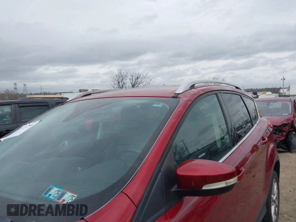 2016 Ford Escape Titanium with VIN 1FMCU9J92GUB13000, listed as a IAAI auction lot 41725258 with 66,817 mi miles. Bid and sale history available at carsss.com. Image 6.
