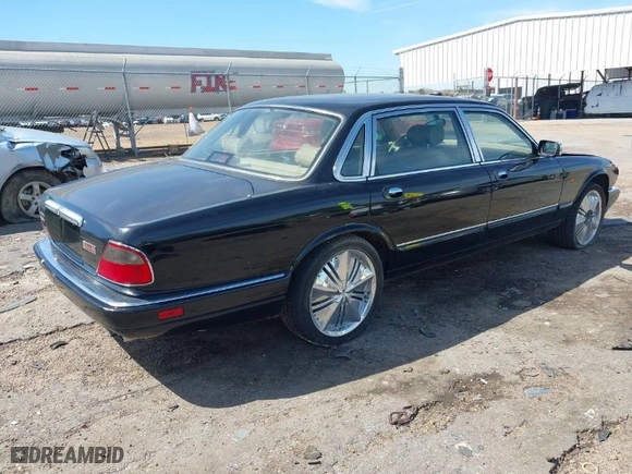 1996 Jaguar XJ Series Sedan Vanden Plas with VIN SAJKX6245TC780444, listed as a IAAI auction lot 41856403 with 1 mi miles. Bid and sale history available at carsss.com. Image 4.