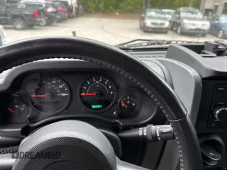 2008 Jeep Wrangler X with VIN 1J4FA24168L582227, listed as a Copart auction lot 58219065 with 98,284 mi miles and Salvage title. Bid and sale history available at DreamBid. Image 8.