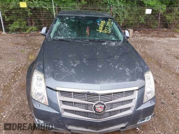 2009 Cadillac CTS AWD z VIN 1G6DT57V790133622, wystawiony jako IAAI lot #42272929 z przebiegiem 124 695 mil mil oraz . Historia ofert i sprzedaży dostępna na DreamBid. Obrazek 6.