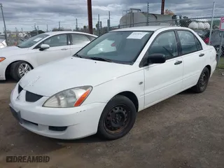 2004 Mitsubishi Lancer ES with VIN JA3AJ26E74U060371, listed as a IAAI auction lot 41636927 with 165,456 mi miles. Bid and sale history available at carsss.com. Image 2.