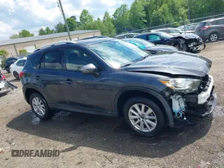 2015 Mazda CX-5 Touring with VIN JM3KE4CY9F0506879, listed as a IAAI auction lot 42209768 with 87,690 mi miles and . Bid and sale history available at DreamBid. Image 14.
