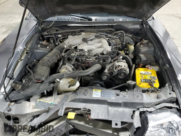 2003 Ford Mustang Deluxe z VIN 1FAFP44433F369534, wystawiony jako Copart lot #76606794 z przebiegiem 88 503 mil mil oraz Szkoda całkowita • Salvage title. Historia ofert i sprzedaży dostępna na DreamBid. Obrazek 11.