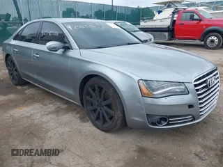 2012 Audi A8 with VIN WAUAVAFDXCN005748, listed as a IAAI auction lot 42540536 with 163,562 mi miles and . Bid and sale history available at DreamBid. Image 1.