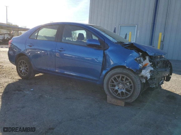 2010 Toyota Yaris with VIN JTDBT4K35A4065709, listed as a Copart auction lot 87197474 with 101,264 mi miles and Salvage Title. Bid and sale history available at carsss.com. Image 4.