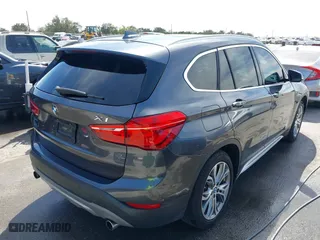 2017 BMW X1 xDrive28i with VIN WBXHT3Z33H4A65198, listed as a IAAI auction lot 41798503 with 88,951 mi miles. Bid and sale history available at carsss.com. Image 4.