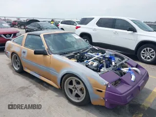 1986 Nissan 300ZX z VIN JN1HZ14S8GX144992, wystawiony jako IAAI lot #42081882 z przebiegiem 127 316 mil mil oraz . Historia ofert i sprzedaży dostępna na DreamBid. Obrazek 1.