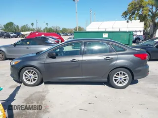 2018 Ford Focus SE z VIN 1FADP3F27JL245603, wystawiony jako IAAI lot #41773395 z przebiegiem 94 044 mil mil oraz . Historia ofert i sprzedaży dostępna na DreamBid. Obrazek 14.