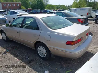 1997 Toyota Camry LE z VIN 4T1BG22K3VU808174, wystawiony jako IAAI lot #42237077 z przebiegiem 100 049 mil mil oraz . Historia ofert i sprzedaży dostępna na DreamBid. Obrazek 3.