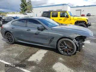 2025 BMW 8 Series M850i with VIN WBAGV8C07SCT18237, listed as a Copart auction lot 49277375 with 750 mi miles and Salvage title. Bid and sale history available at DreamBid. Image 4.