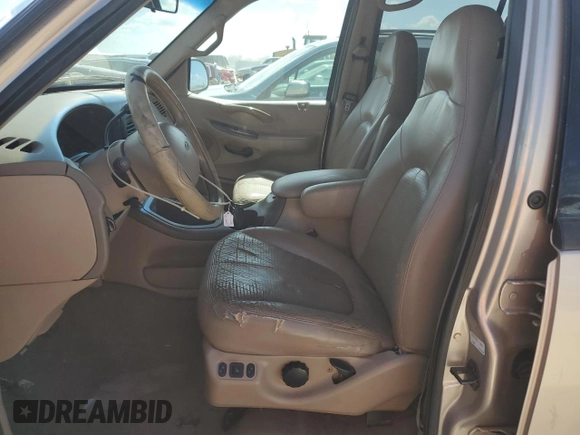 1997 Ford Expedition XLT with VIN 1FMEU17L7VLB84516, listed as a Copart auction lot 76664984 with 269,040 mi miles and Salvage title. Bid and sale history available at DreamBid. Image 7.