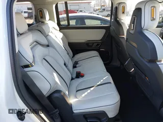 2024 Rivian R1S Adventure with VIN 7PDSGBBA9RN039684, listed as a IAAI auction lot 41558846 with 13,725 mi miles. Bid and sale history available at carsss.com. Image 8.