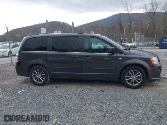 2014 Dodge Grand Caravan SXT with VIN 2C4RDGCG6ER376714, listed as a IAAI auction lot 41828025 with 172,285 mi miles and . Bid and sale history available at DreamBid. Image 13.