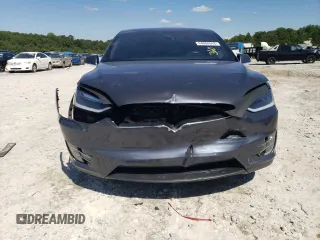 2017 Tesla Model X 90D z VIN 5YJXCDE23HF051027, wystawiony jako Copart lot #64608843 z przebiegiem 77 222 mil mil oraz Szkody całkowita. Historia ofert i sprzedaży dostępna na DreamBid. Obrazek 5.