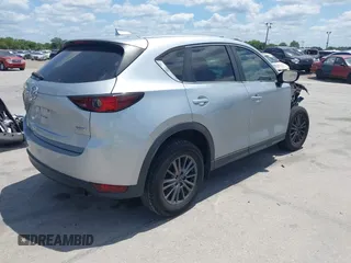 2017 Mazda CX-5 Sport with VIN JM3KFABLXH0135560, listed as a IAAI auction lot 42062016 with 153,416 mi miles. Bid and sale history available at carsss.com. Image 4.