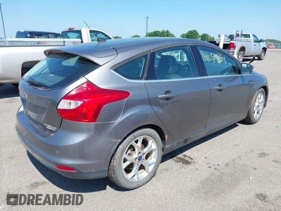 2014 Ford Focus Titanium with VIN 1FADP3N22EL317007, listed as a IAAI auction lot 42641134 with 159,705 mi miles and . Bid and sale history available at DreamBid. Image 4.