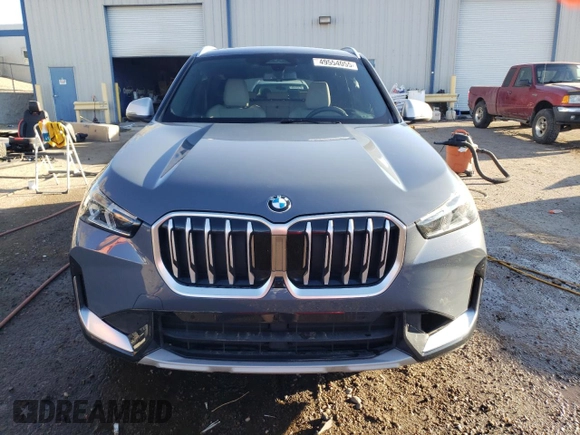 2024 BMW X1 xDrive28i with VIN WBX73EF00R5Z58004, listed as a Copart auction lot 49554055 with 4,053 mi miles and Salvage title. Bid and sale history available at DreamBid. Image 5.