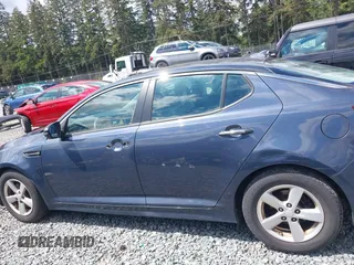 2015 Kia Optima LX z VIN KNAGM4A74F5590332, wystawiony jako IAAI lot #42304364 z przebiegiem 131 720 mil mil oraz . Historia ofert i sprzedaży dostępna na DreamBid. Obrazek 14.