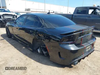 2019 Dodge Charger R/T with VIN 2C3CDXCT2KH575297, listed as a IAAI auction lot 41661339 with 119,854 mi miles and . Bid and sale history available at DreamBid. Image 3.