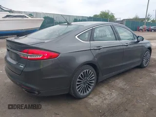 2017 Ford Fusion Titanium with VIN 3FA6P0K96HR208757, listed as a IAAI auction lot 42400172 with 90,000 mi miles and . Bid and sale history available at DreamBid. Image 4.