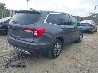 2019 Honda Pilot EX-L with VIN 5FNYF5H45KB018293, listed as a IAAI auction lot 42318481 with 76,617 mi miles and . Bid and sale history available at DreamBid. Image 4.
