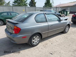 2003 Hyundai Accent GL z VIN KMHCG35CX3U243322, wystawiony jako IAAI lot #42277841 z przebiegiem 45 855 mil mil oraz . Historia ofert i sprzedaży dostępna na DreamBid. Obrazek 4.