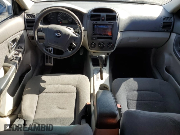 2006 Kia Spectra EX with VIN KNAFE121365229594, listed as a Copart auction lot 77311084 with 129,789 mi miles and Salvage Title. Bid and sale history available at carsss.com. Image 8.
